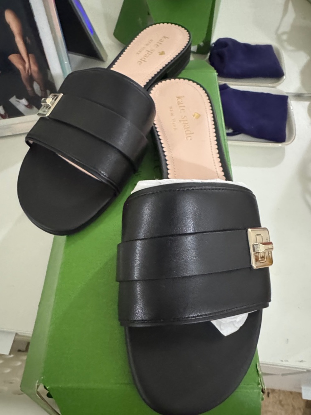 kate spade Black Leather Slide Mules with Gold Buckle Accent
